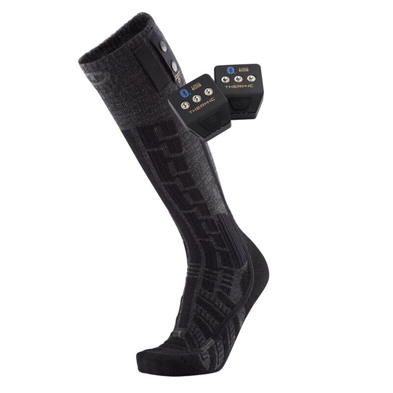 A dark gray and black patterned compression sock shown on a white background, with two small black electronic control units attached near the top.