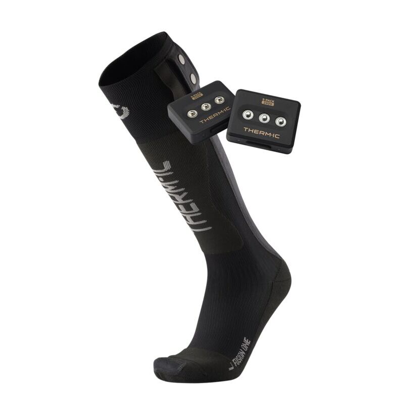 Black compression sock with electronic device on a white background