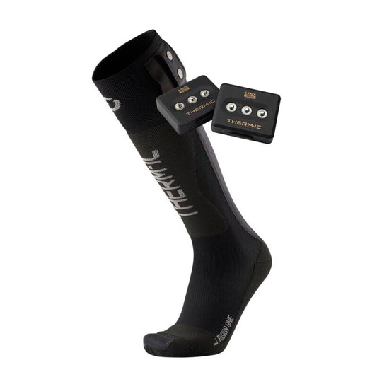 Black compression sock with electronic device on a white background